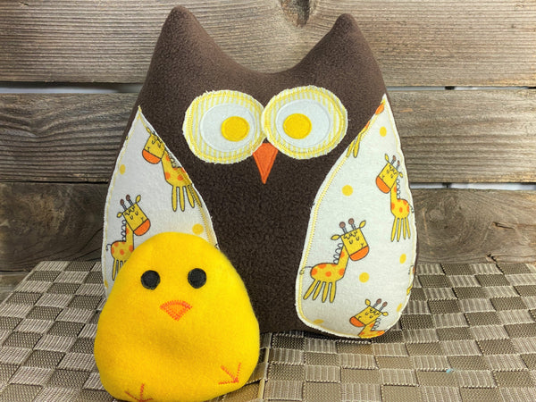 Brown owl pillow with giraffes and a yellow hot and cold chick for boo boos