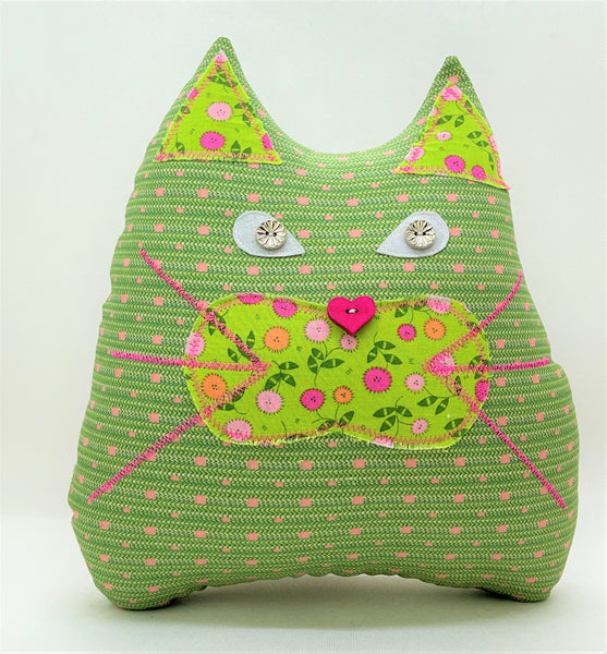 Green and pink cat pillow with floral print