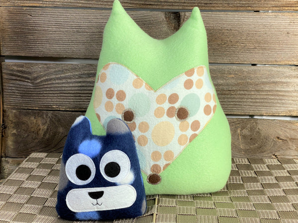 Pale green fox pillow with tan green and yellow polka dots with a blue cat hot and cold pack