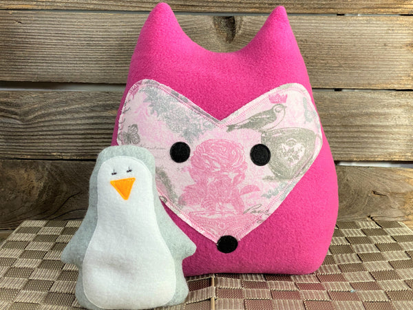 Hot pink fox pillow with pink and gray roses birds and butterflies with a gray penguin hot and cold pack