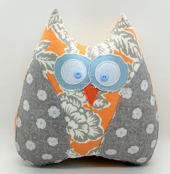 Orange and gray owl pillow with baby blue accents