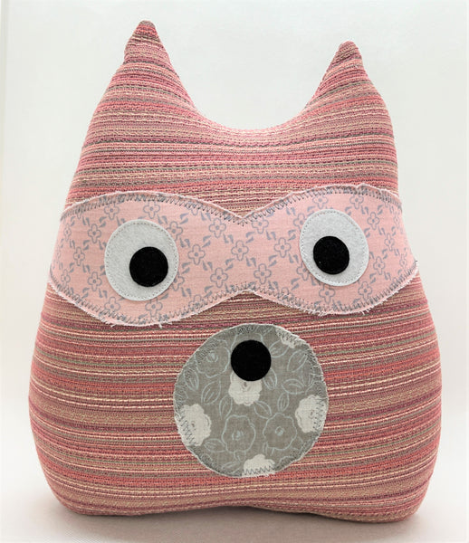 raccoon pillow in pinks and grays