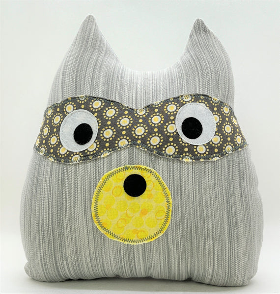 gray raccoon pillow with gray and yellow accents