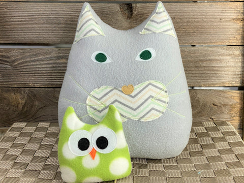 Gray cat pillow with chevron print and a green and white polka dot owl hot and cold pack