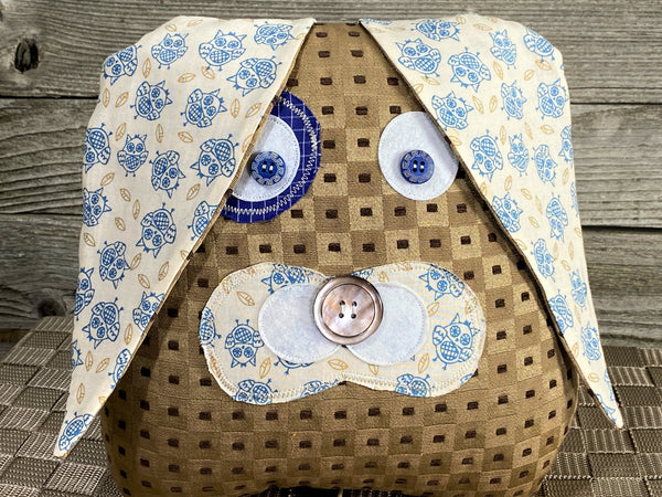 Beige checked bunny pillow with blue owl fabric