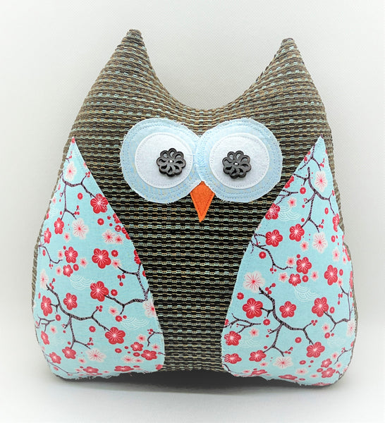 brown and blue striped owl pillow with red cherry blossoms