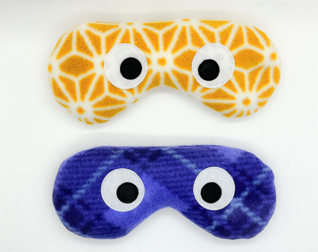 eye masks in a gold and white lattice and purple plaid prints