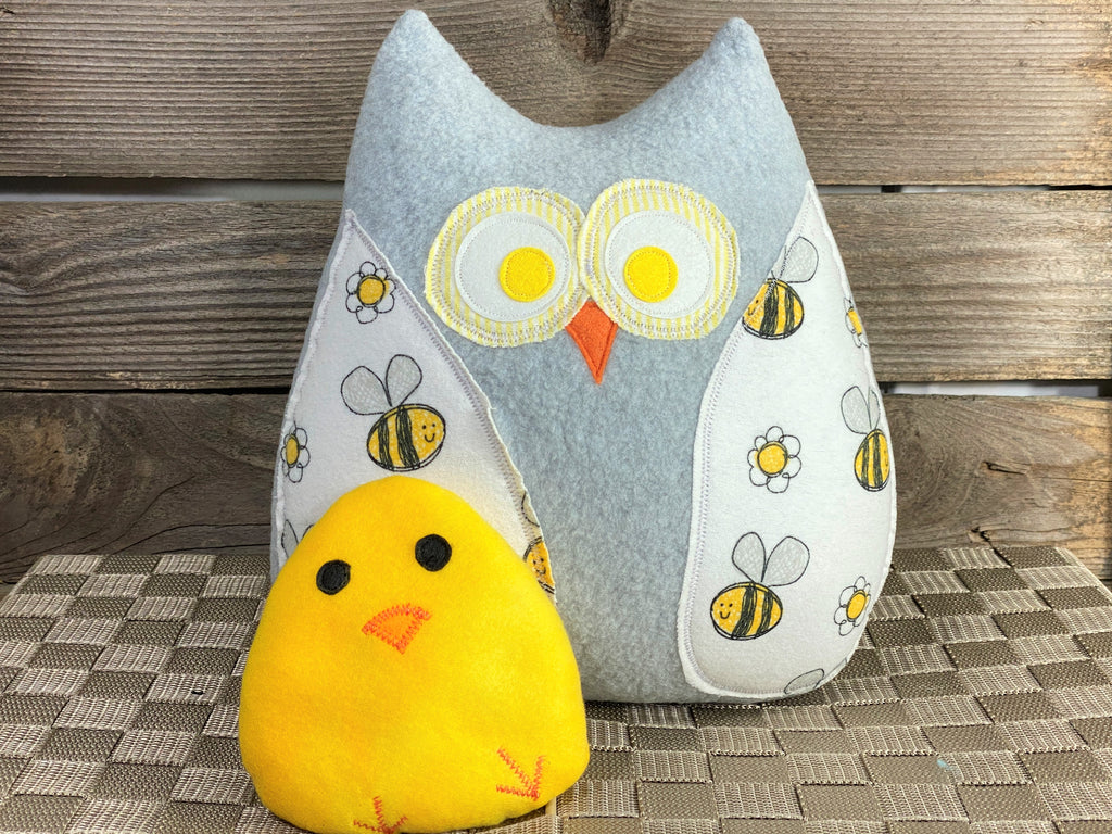 Gray owl pillow with bees and a yellow hot and cold chick for boo boos