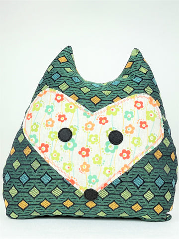 Fox doorstop made from orange and green geometric print with coordinating floral fabric 