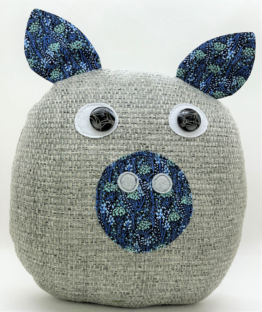 gray pig pillow with blue floral accent fabric