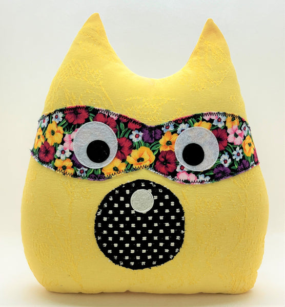 yellow raccoon pillow black and floral accents