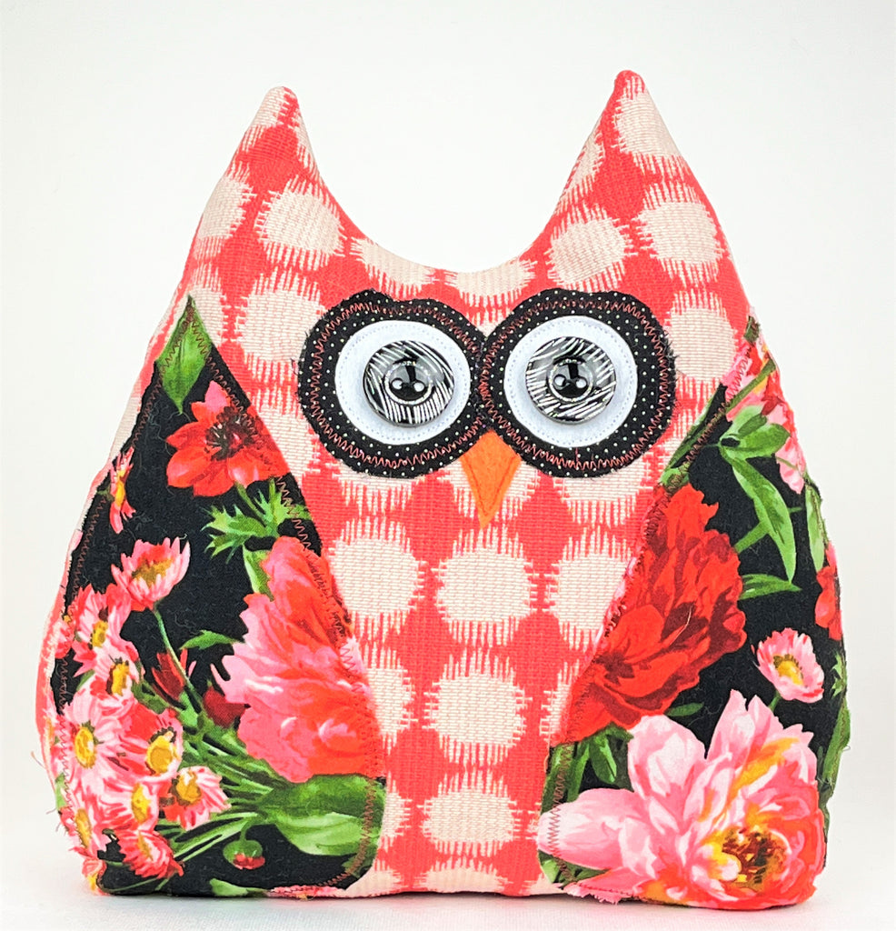 Salmon and cream owl doorstop with black and pink floral accents